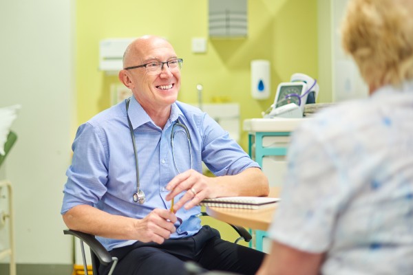 Image of a doctor speaking to a patient